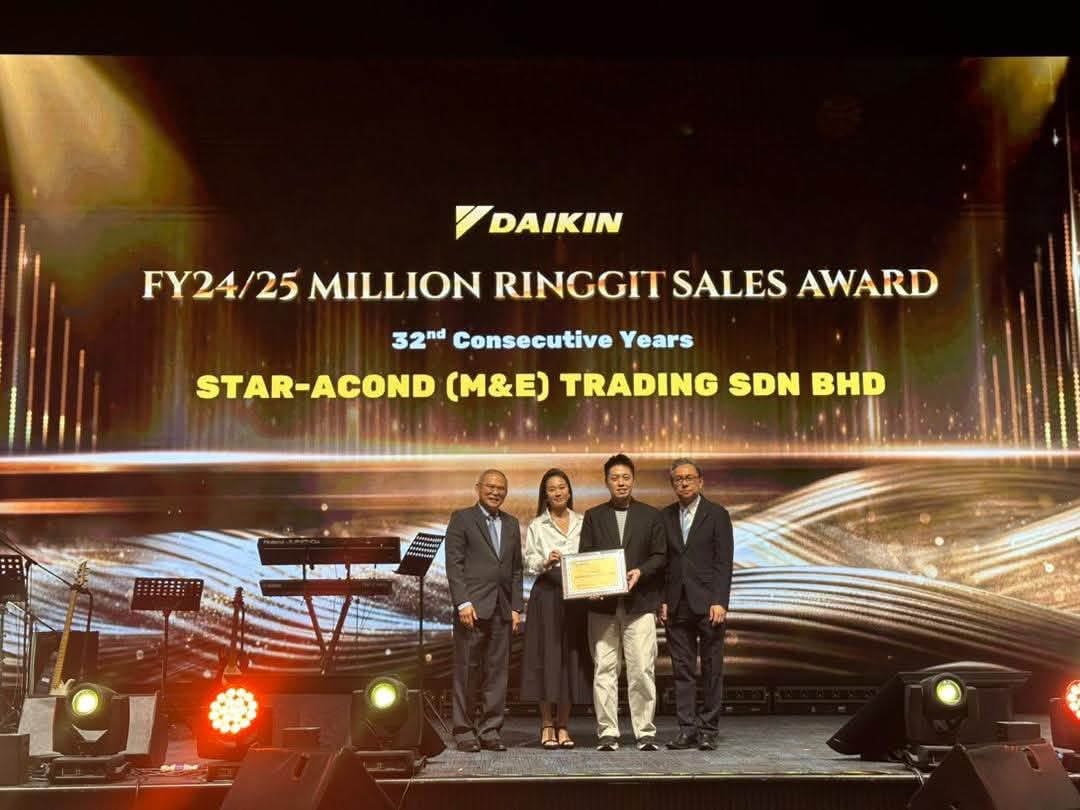 Star-Acond receiving the Daikin FY24/25 Million Ringgit Sales Award on stage, 32nd consecutive year
