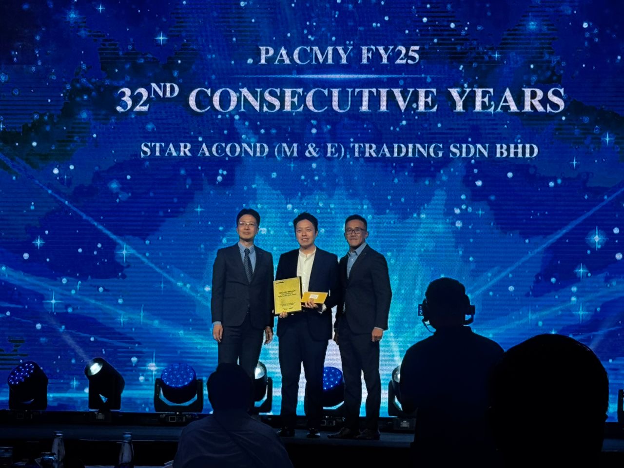 Star-Acond receiving the Panasonic FY25 Million Ringgit Sales Award on stage, 32nd consecutive year