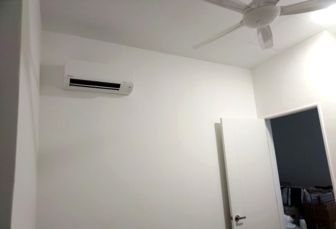 Daikin indoor air-conditioning unit installed alongside ceiling fan
